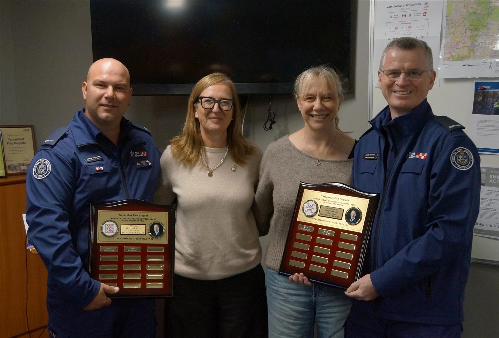 Yarrambat Captain Andrew Napoleone, Claire O&rsquo;Riordan, Karen Wanless, and Plenty Captain David Rumble with the commemorative plaques.